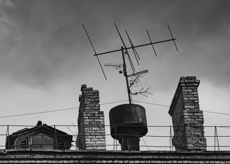 an old satellite dish is on top of a building