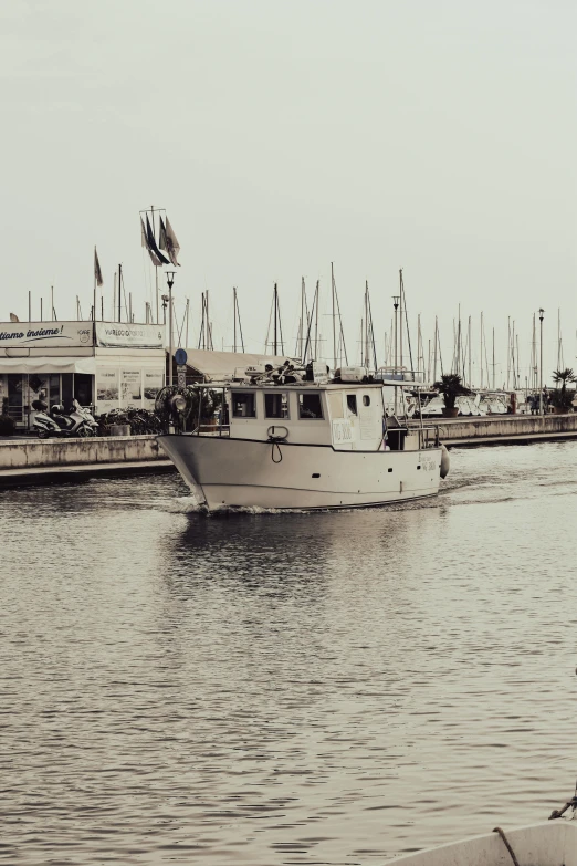 a boat that is in some water near some buildings