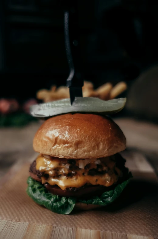 an image of hamburger on wooden table