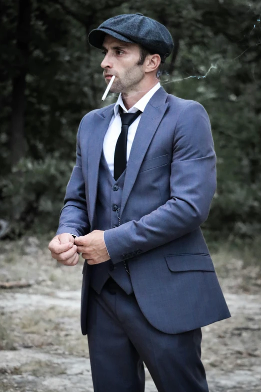 a man is holding a cigarette in his mouth