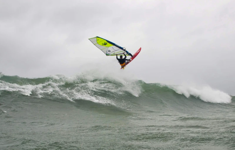 a person on a surfboard rides a wave