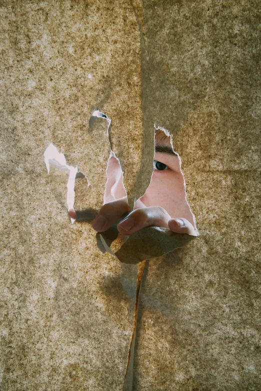 a broken shoe in front of a stucco wall