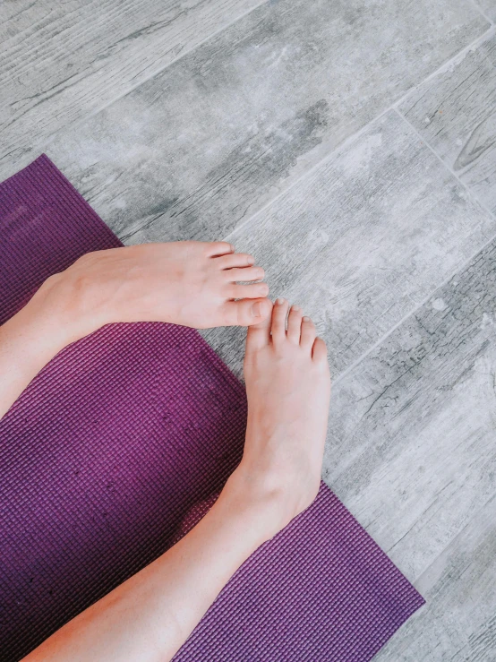 the legs of a woman on a mat