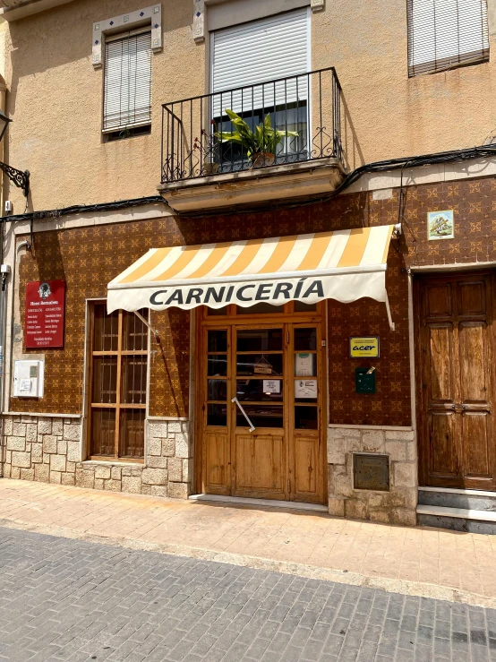 a large brown and white striped awning on a building