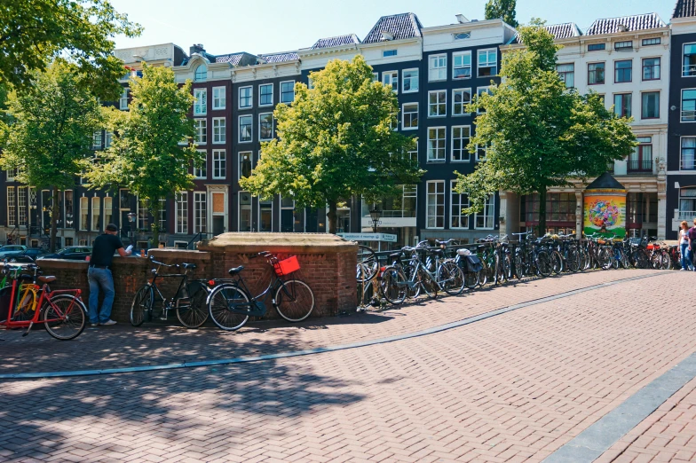 several bikes parked next to each other on a sidewalk