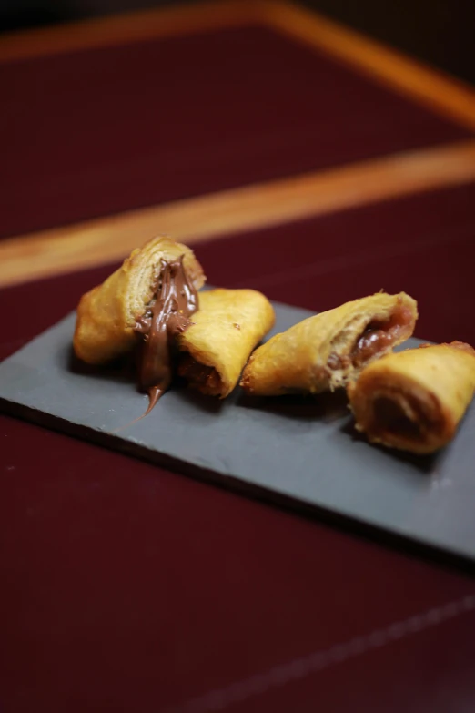 chocolate and coconut hand foods on top of a black plate