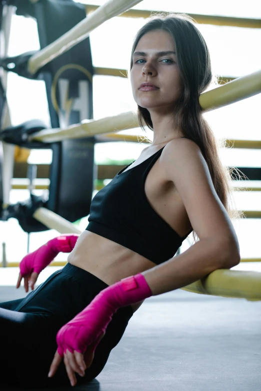 a woman wearing pink gloves and leggings