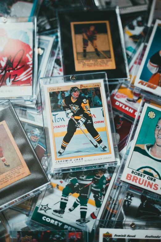 some hockey cards are on display in a pile