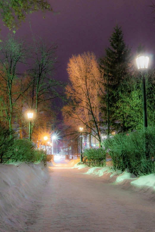 the streetlights shine brightly during a nighttime time