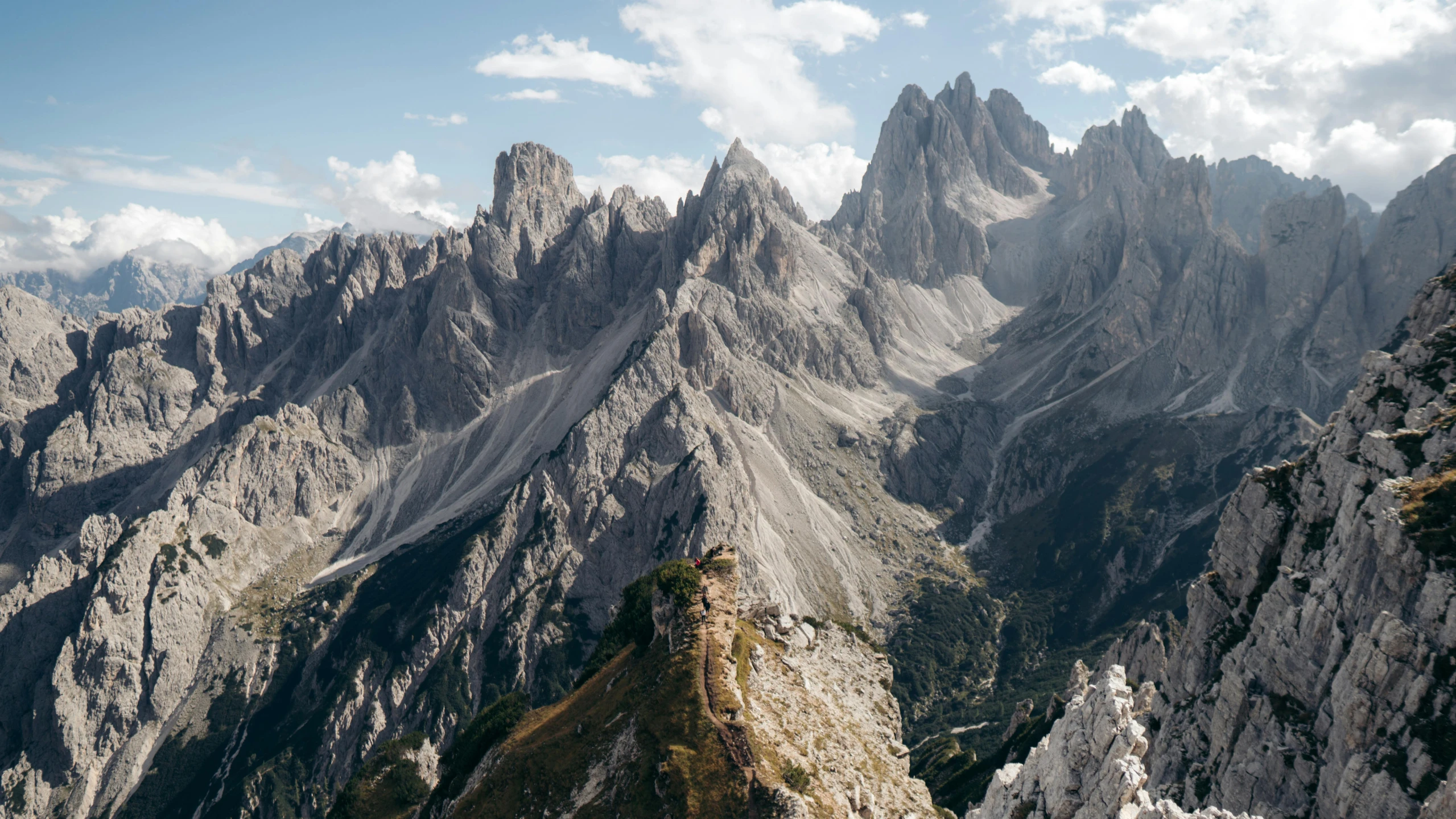 a scenic view from the top of a steep mountain