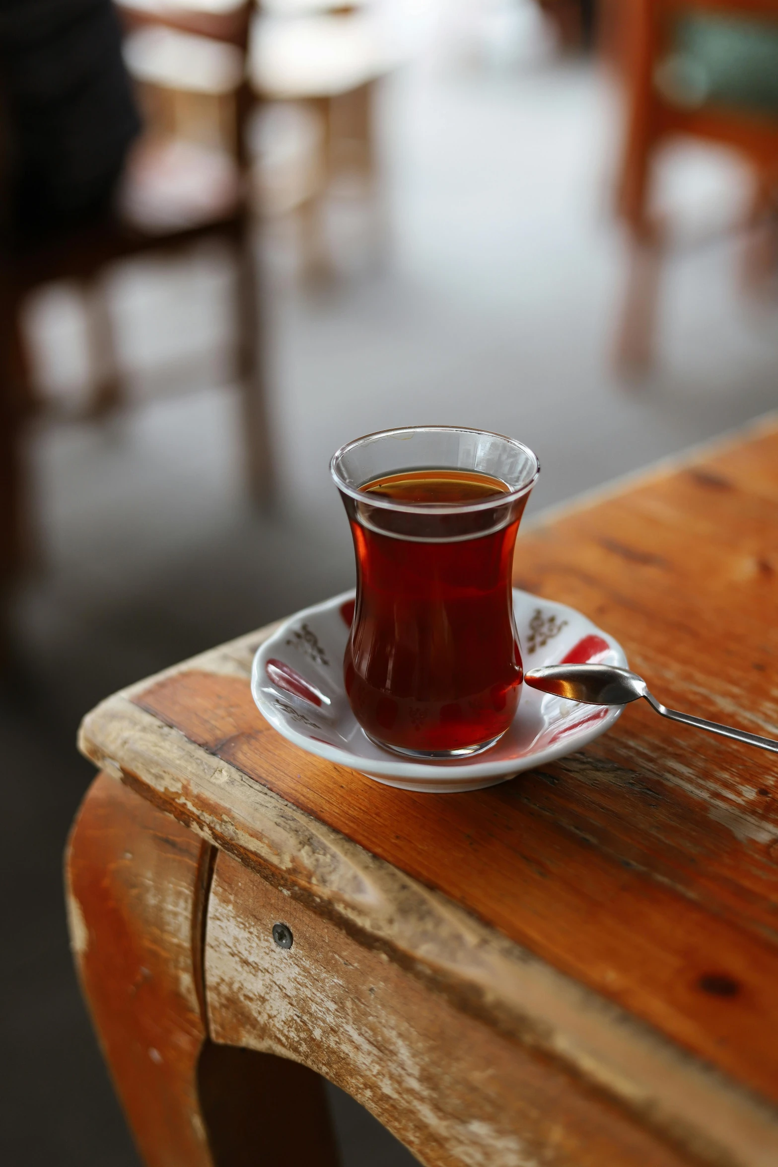 a cup of coffee on a wooden table