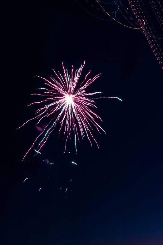 fireworks are lit up at night in a dark sky