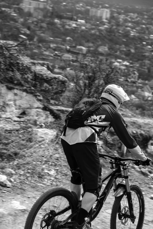 a person riding a mountain bike on a dirt road