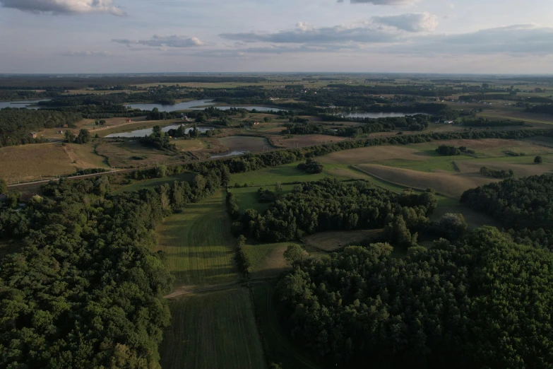 an aerial view shows the rolling land and water