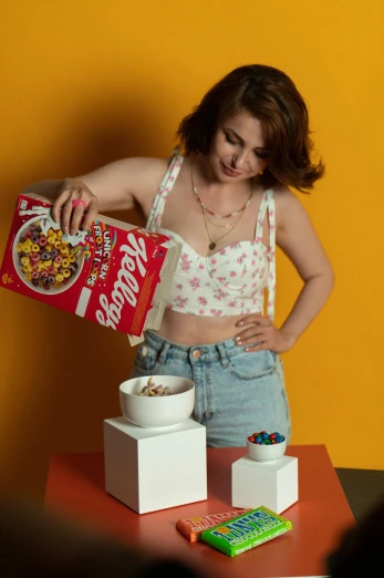 a woman pouring cereal in a bucket and bowl