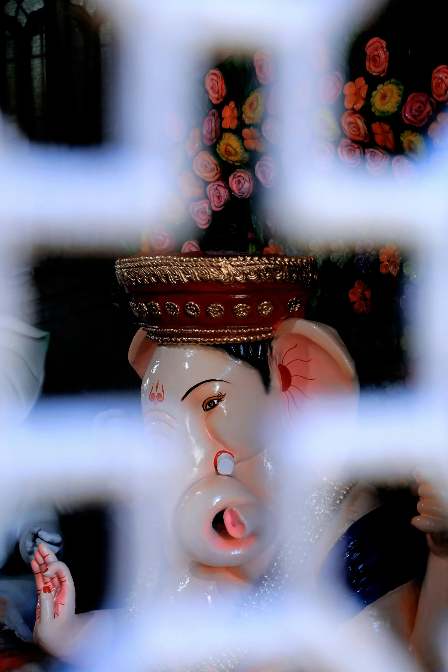 a statue of a lord in front of a window