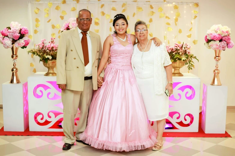 the couple and their granddaughters are posing for a picture