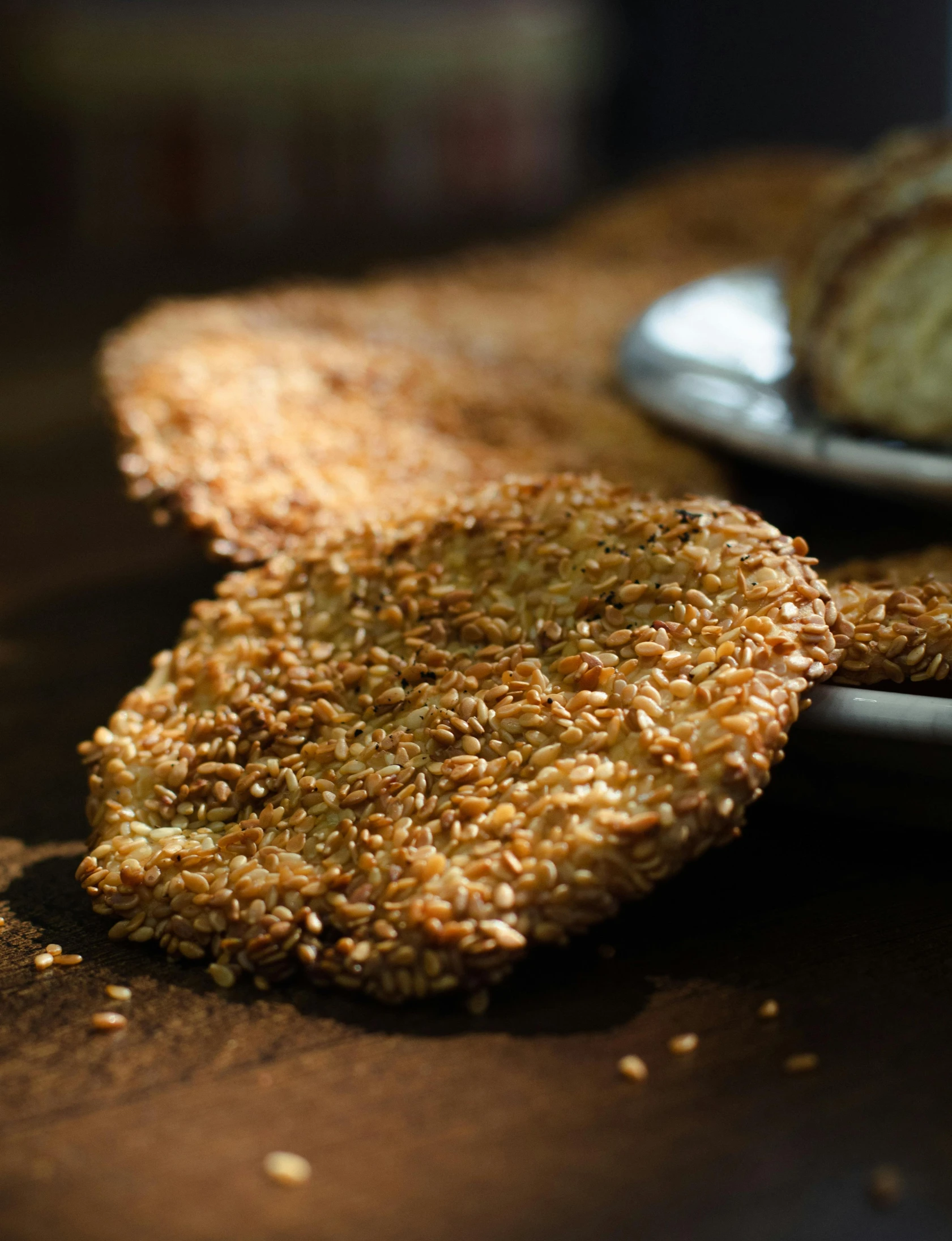 a close up of bread on a table next to plates