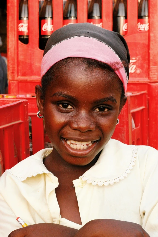 an african woman smiles at the camera