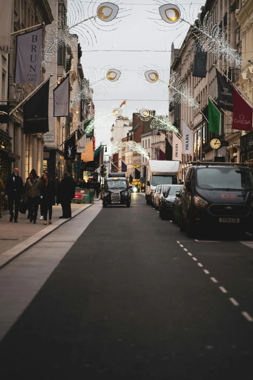 cars parked on the side of a busy street