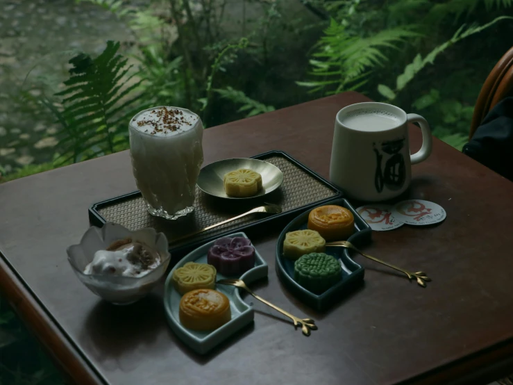 a couple of plates filled with desserts on a table