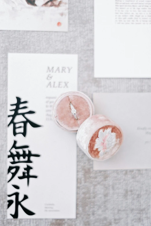 a small candle on top of paper with japanese writing on it