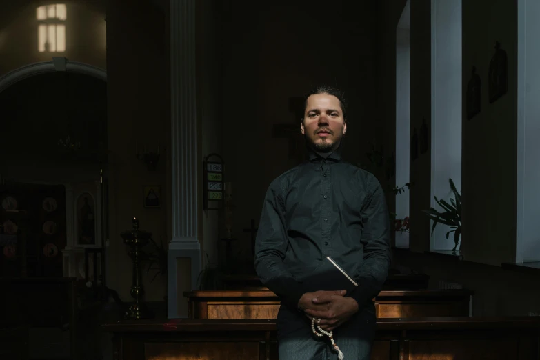 a man standing in front of a counter at the alter