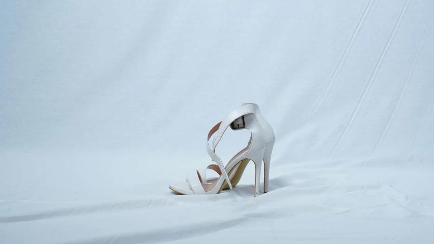 a white dress shoe that is on a white surface