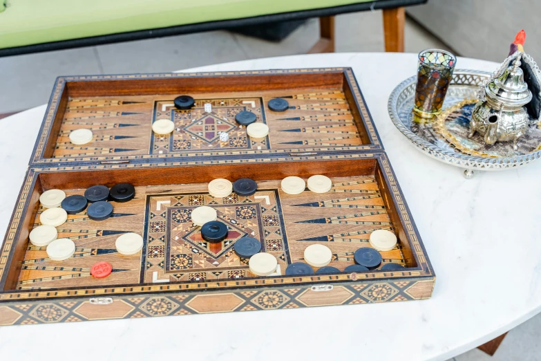 a table with a game board, tray and condiments