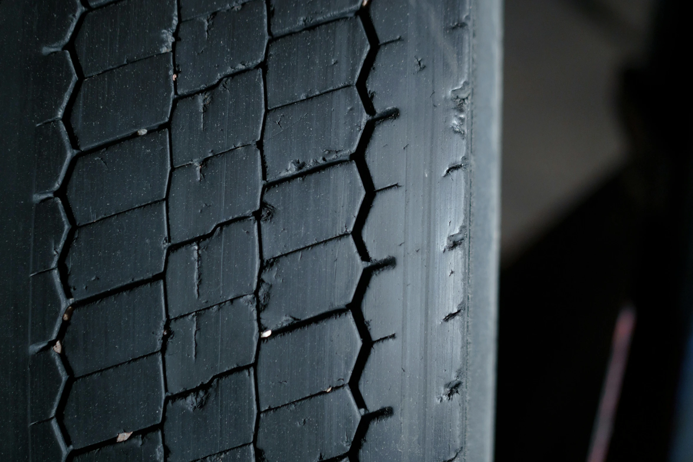 black tire and tread on vehicle parked on street