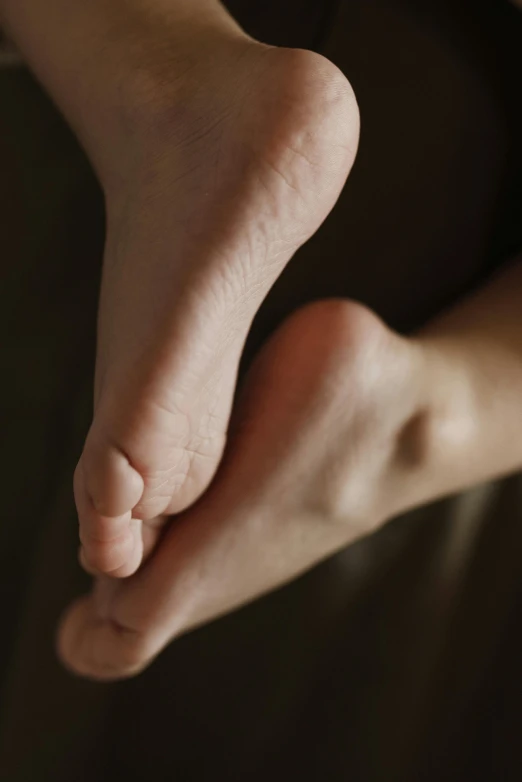 a person's feet are outstretched in front of a window