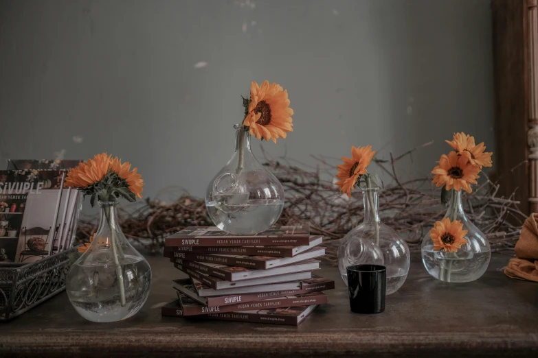 some pretty vases filled with beautiful flowers on top of a table