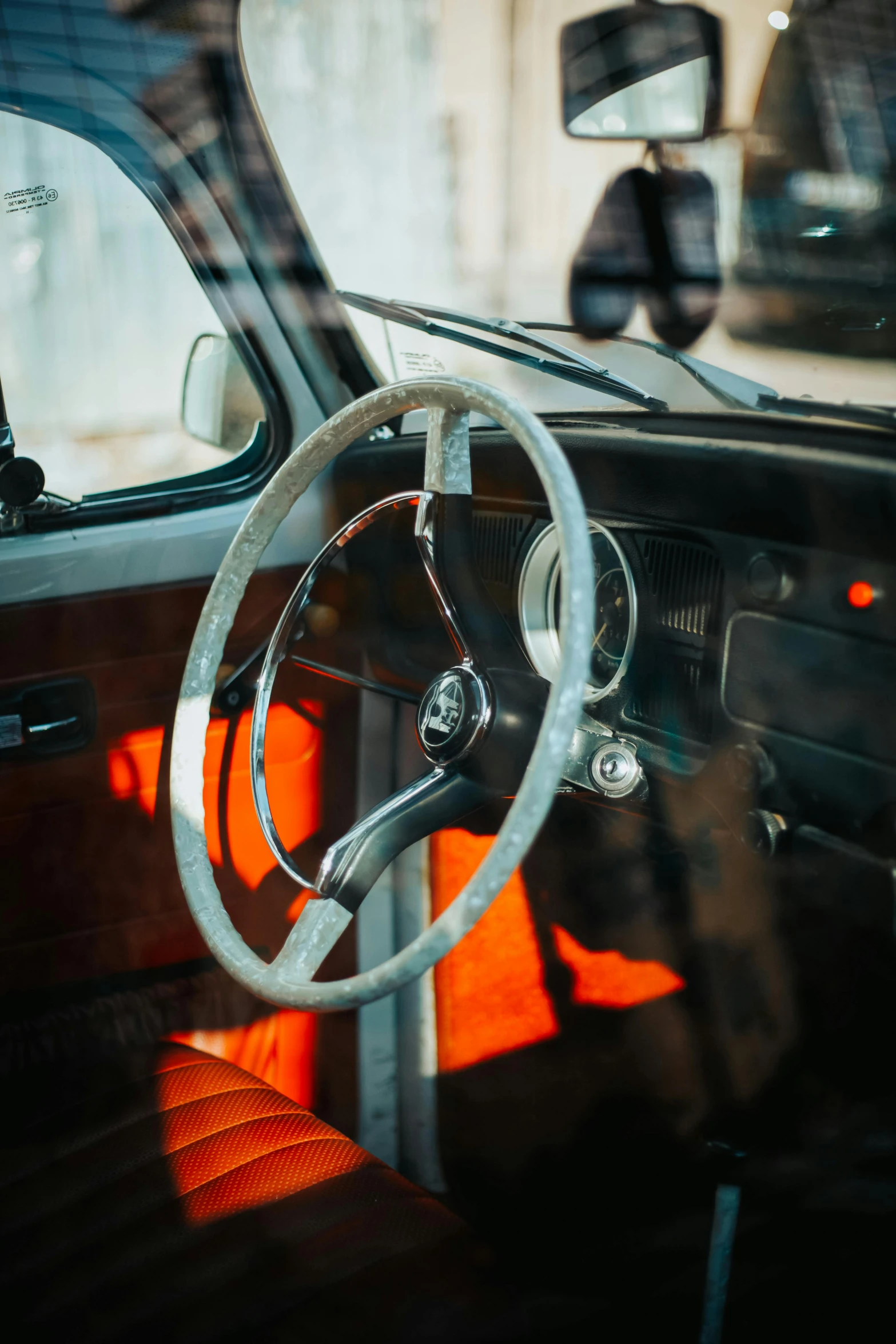 the interior of an old model car, with the dash light turned off