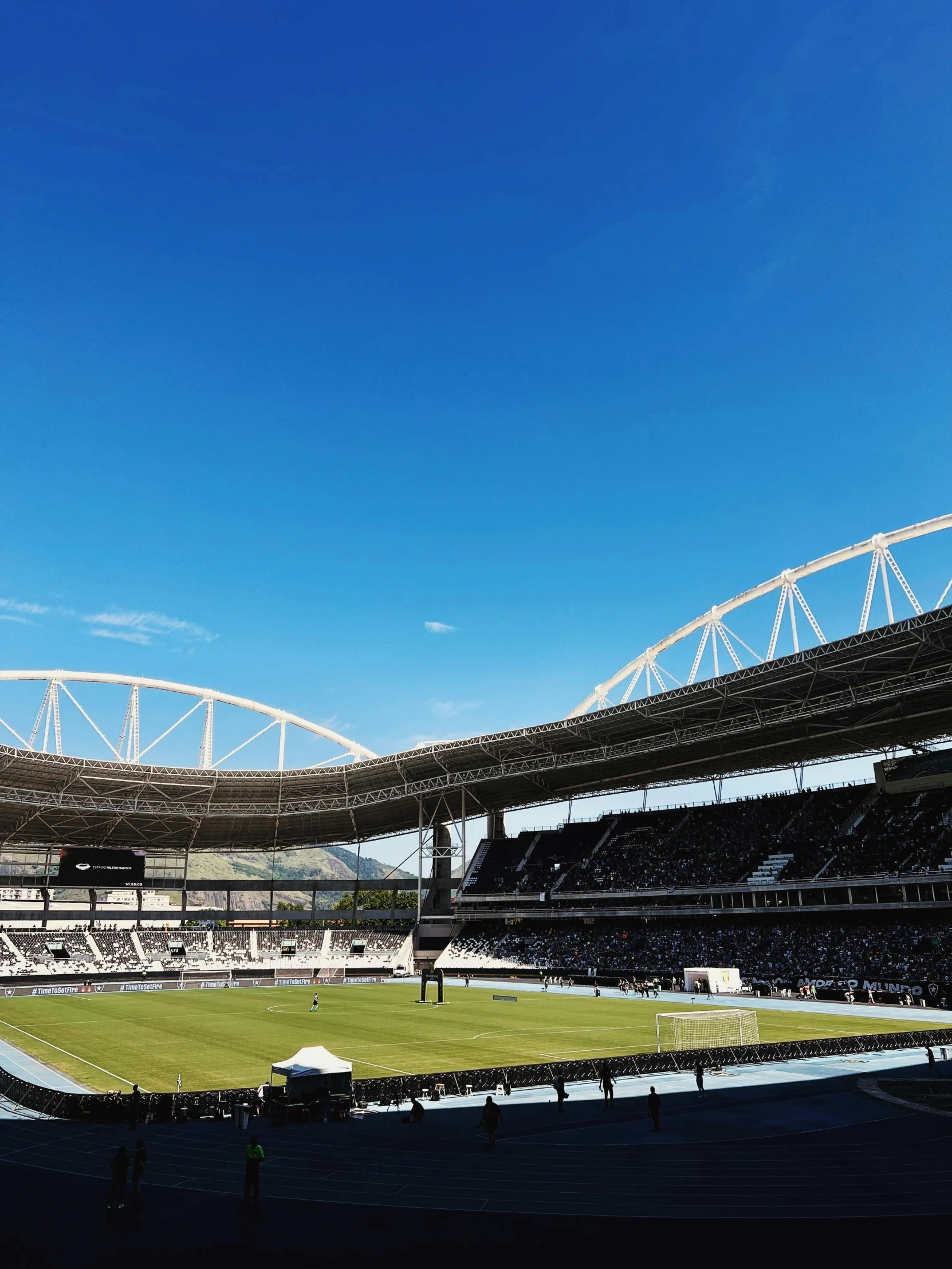 a soccer field is empty and with chairs