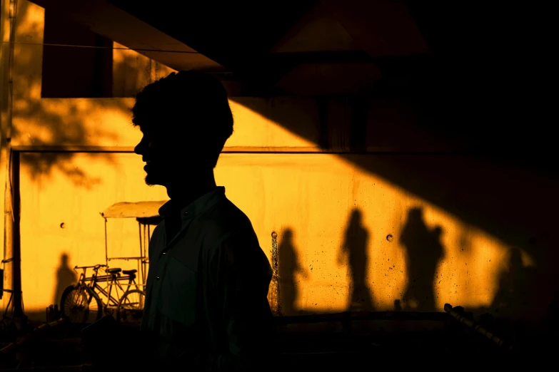 the shadow of a person in front of a wall