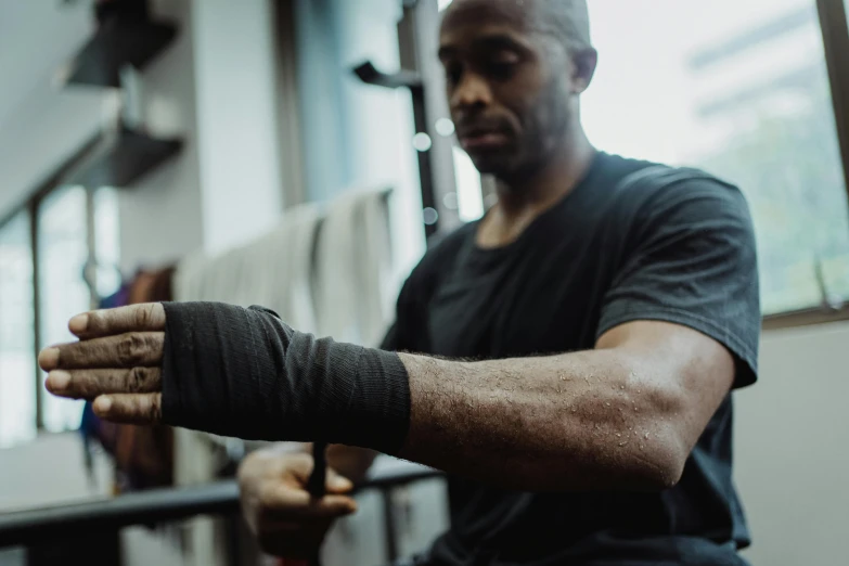 a man with a cast on his arm is doing an exercise