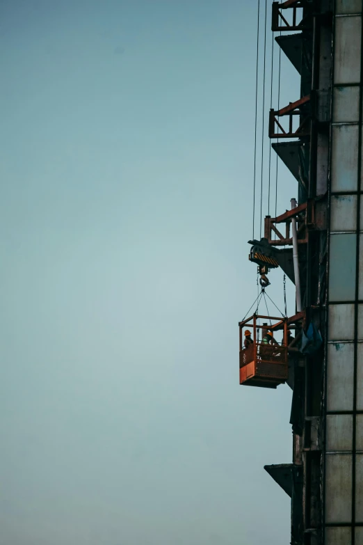 people are riding the rope climbers in the sky