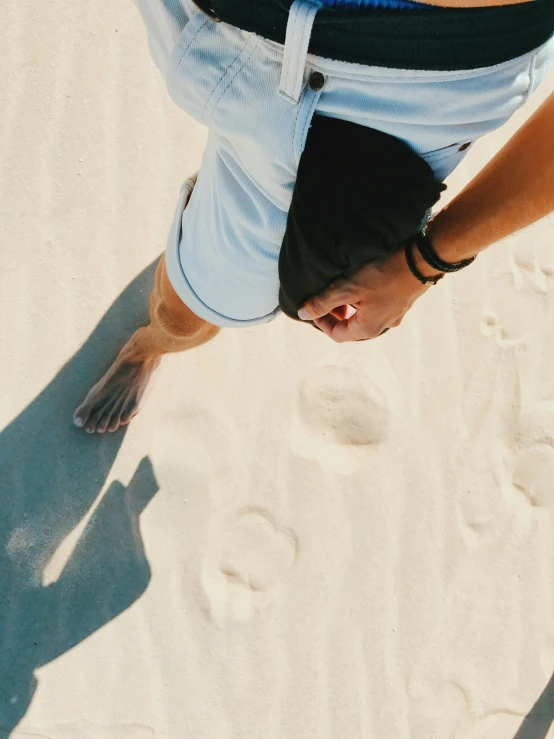 a person has their feet in the sand