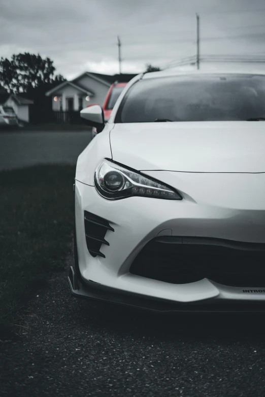 the front end of a white sports car