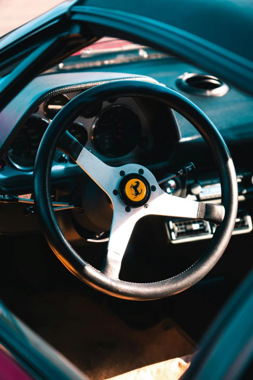 a car with a black and gold steering wheel