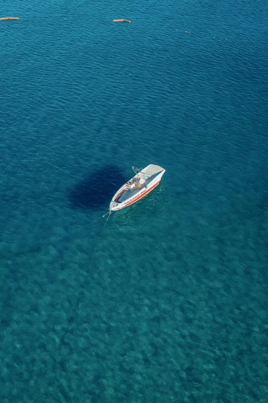 a boat in the clear blue ocean