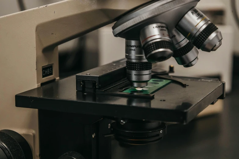 a microscope being used to take samples of a cell phone