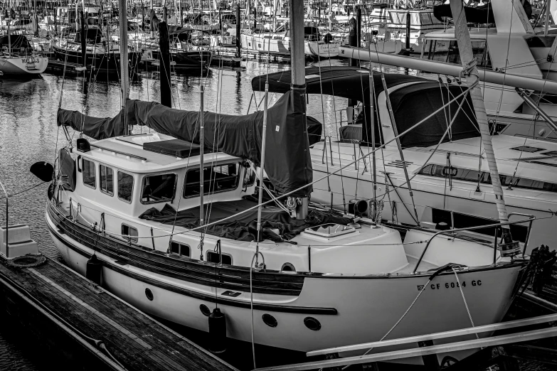 a large boat sitting in the water next to a dock