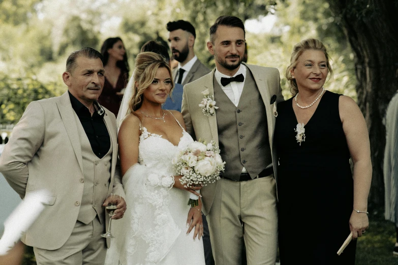 a wedding in front of a group of people