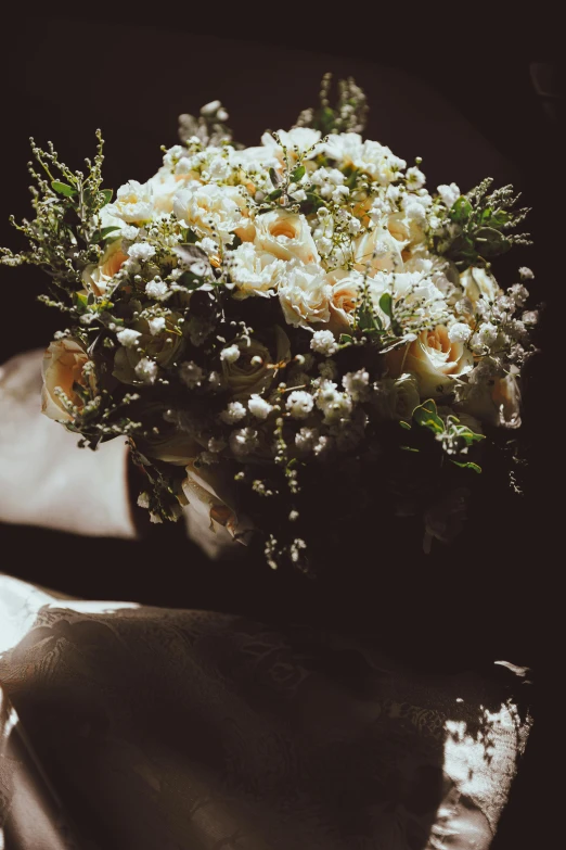 a bouquet of flowers sits on the table