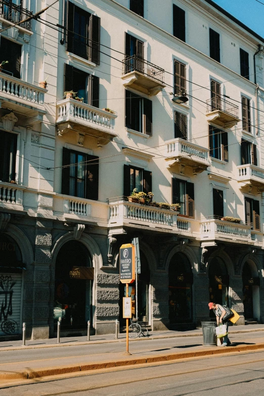 a building on a side walk near a street