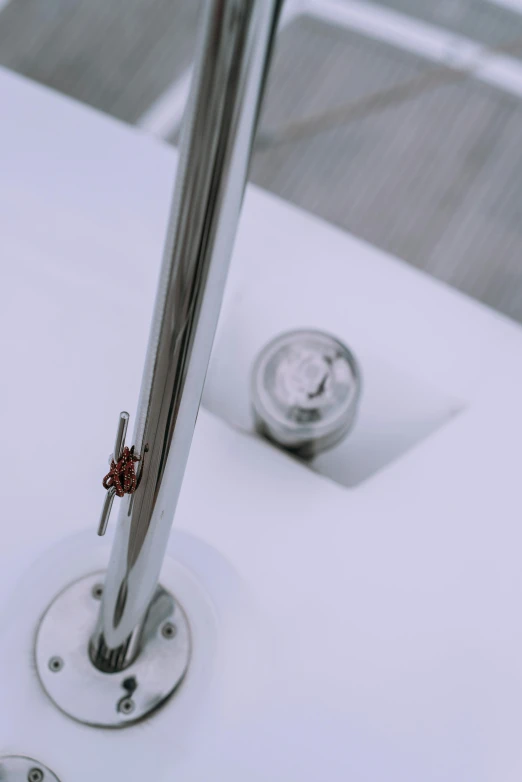 the metal arm of a boat and a small clock