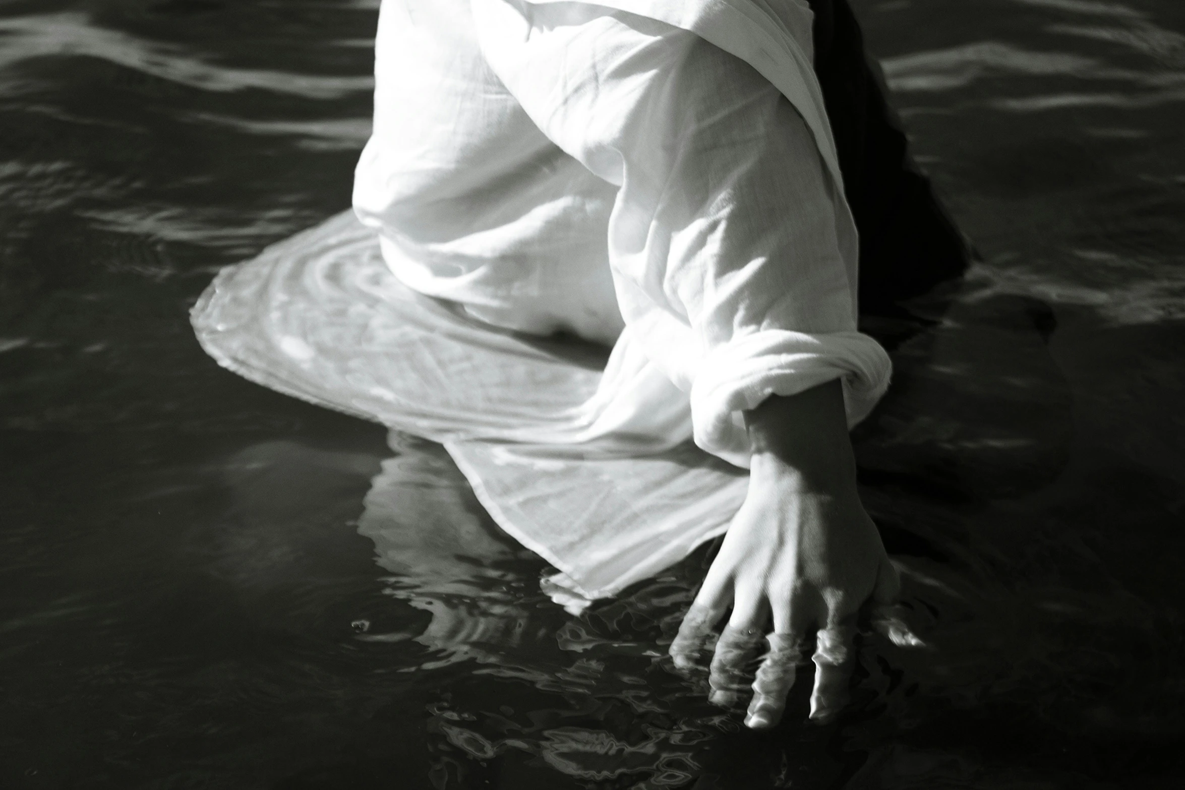 a person floating on top of a body of water