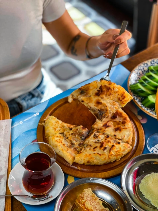 a table filled with various food items and bowls