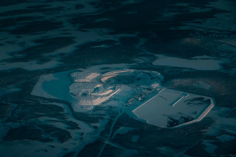 an aerial view of a large hangar under construction